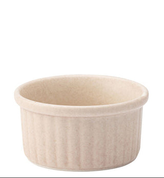 Beige ceramic ramekin on a white background